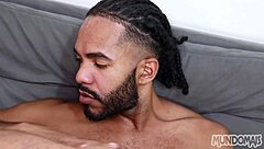 Black and white gay couple relaxes with bareback sex after soccer game