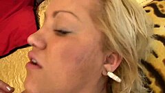 Big-boobed blonde in fishnets moans with cum shower