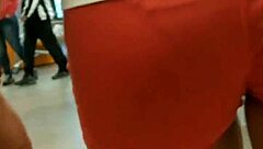 Beautiful girl showing off her ass in tight shorts at the market