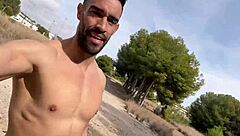 A hunk with a big dick having sex outdoors in Barcelona