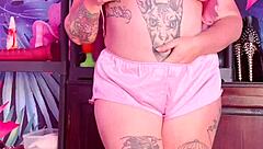 Teasing in silk pajamas with huge natural tits.