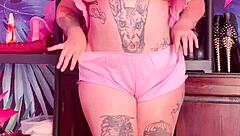 Teasing in silk pajamas with huge natural tits.