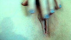 Close up of a chipped nail polish and an orgasm with a glass dildo
