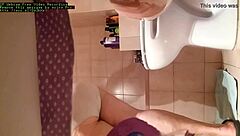 A big-boobed MILF is caught in the act