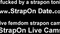 A huge strapon dildo in his ass for domination and anal sex