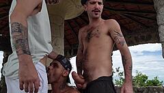 Gay guys having fun outdoors on a big dick paradise