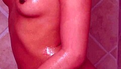 Is tiny brunette showering with mother-in-law? Lesbian photoshoot turns steamy!