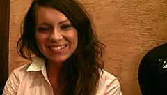 A brunette gives a blow job for money to a black man outdoors