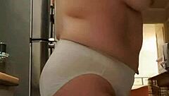 my wife lounges in big panties in the kitchen, teasing me softly