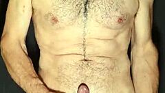 Gay man exhibits big cock and masturbates