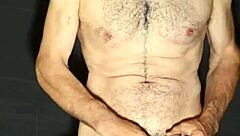 Gay man exhibits big cock and masturbates