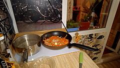 Naked gay chef cooks rice noodle with chicken and vegetables