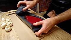 Naked gay chef cooks rice noodle with chicken and vegetables