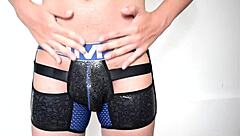 Gay boxer in briefs showing off his large cock