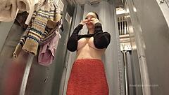 i try on clothes in fitting room with open curtain