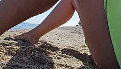 natural girl enjoys nudism on public beach