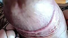 Foot fetish guy fucks her deliciously, cumming on her fishnet feet.