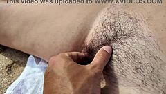 Whoa, stranger gropes MILF’s hairy pussy on beach