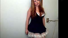 Red-haired beauty strips and exposes herself