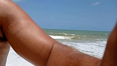 Young beauty gets a facial with cum on her face and body on the beach