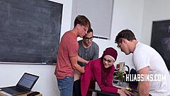 A sexy teacher in a hijab gets naughty with her students