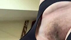 hairy milf does a fetish workout in fishnets at the gym