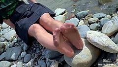 Goddess In Tan Nylons Shows Cute Nylon Soles And Toes On The Riverside