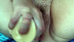 mature chubby milf masturbates hairy wet pussy close up with dildo