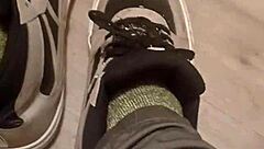 my friend is having fun stepping on and trashing my sneakers with her feet