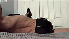 a solo male bodybuilder massages his pelvis for therapeutic release during workout