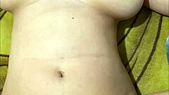 Is This Petite Pregnant Babe Teasing Her Fan on Cam with Close-Up Pussy Shots?