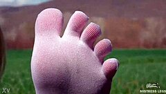 goddess feet in cute white socks on spring grass field 🌸