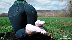 goddess feet in cute white socks on spring grass field 🌸