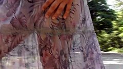 A hot mature woman with hairy pussy in a transparent dress