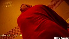 Spy camera footage of a naked girl in the shower with big tits
