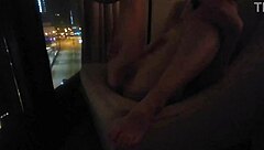 public masturbation tease at hotel window