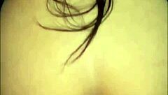 A stunning woman with a captivating presence in the bedroom