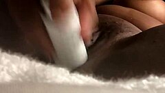 A girl is caressing herself with her fingers