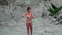 Soap bubbles outdoor adventure turns into a naked mature milf showcase. Watch her shine!