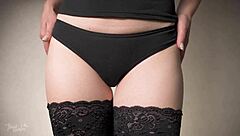 Sensual thigh gap tease in lingerie and fishnets