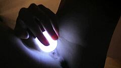 A girl with sleepless nights starts rubbing her clitoris with a flashlight