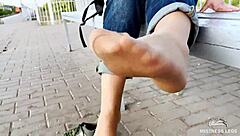 i tease my tan nylon soles in blue jeans on the bench outdoors