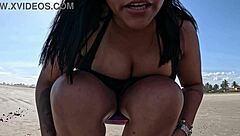 I masturbate on the public beach, cumming under the sun.