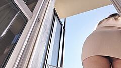 Hot Woman Teases On Balcony Without Panties, Showing Off Her Assets