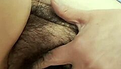 A fat hairy pussy of a hot mature milf revealed while pissing