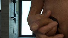 A guy with small dick plays with it, covered with oil