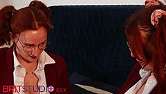 Hey, watch these redhead students munch pussy in uniform!