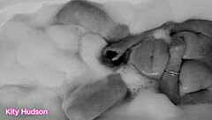 Kity hudson indulges in a steamy bath session with her favorite vibrator, reaching intense orgasms as her mature, hairy body responds eagerly.