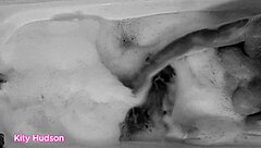 Kity hudson indulges in a steamy bath session with her favorite vibrator, reaching intense orgasms as her mature, hairy body responds eagerly.