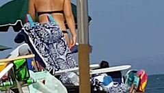 candid shots of this little 18+ slut's ass in a bikini at the beach, hidden from view